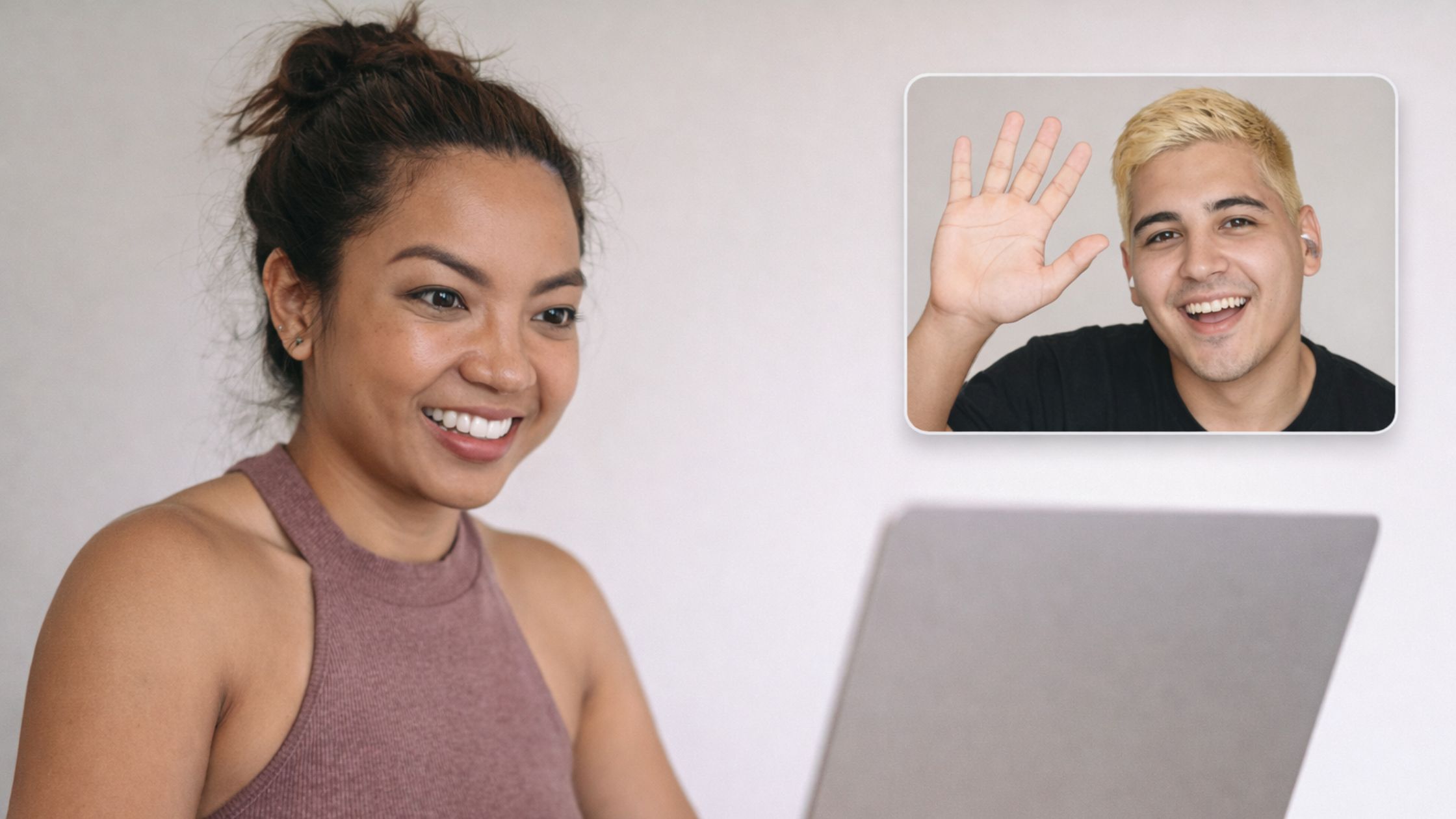 A latino Spanish tutor interacting in Español with a female in her Soho apartment smiling back at him
